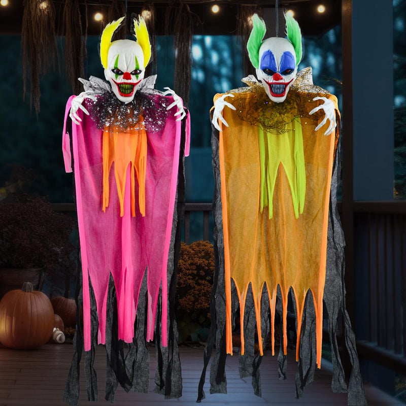 Pair of creepy hanging clown decorations with glowing red eyes