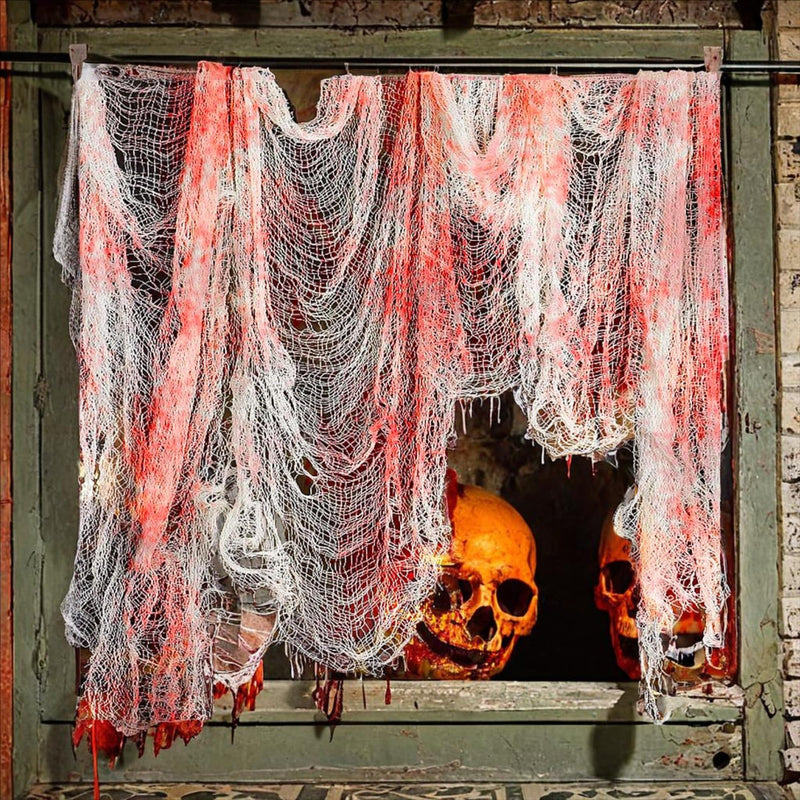 Bloody gauze Halloween cloths draped over a mantel